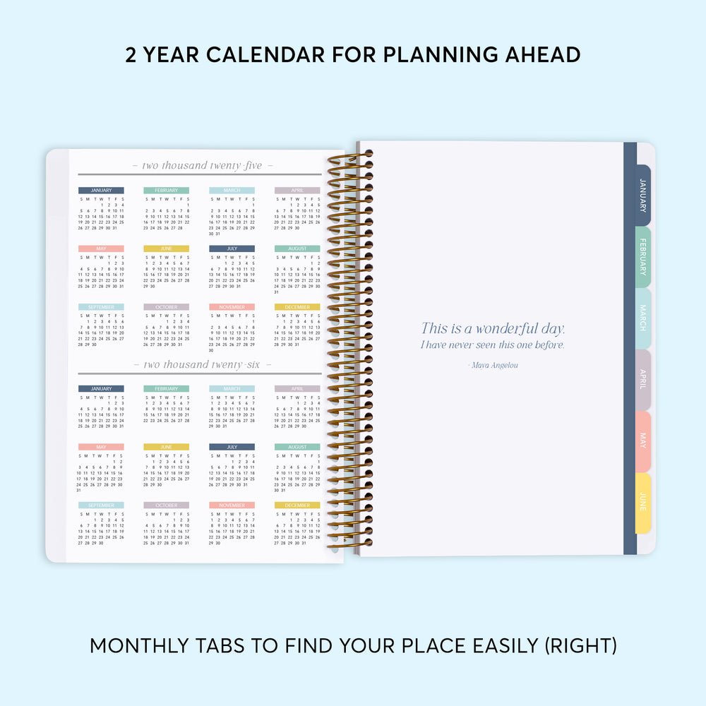 a planner with a notepad on top of it