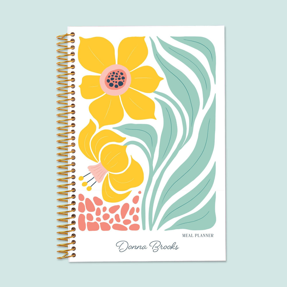 6x9 meal planner with an Artful Flowers Daffodil cover, featuring structured meal planning, food prep tracking, and a dedicated grocery list section for easy organization.