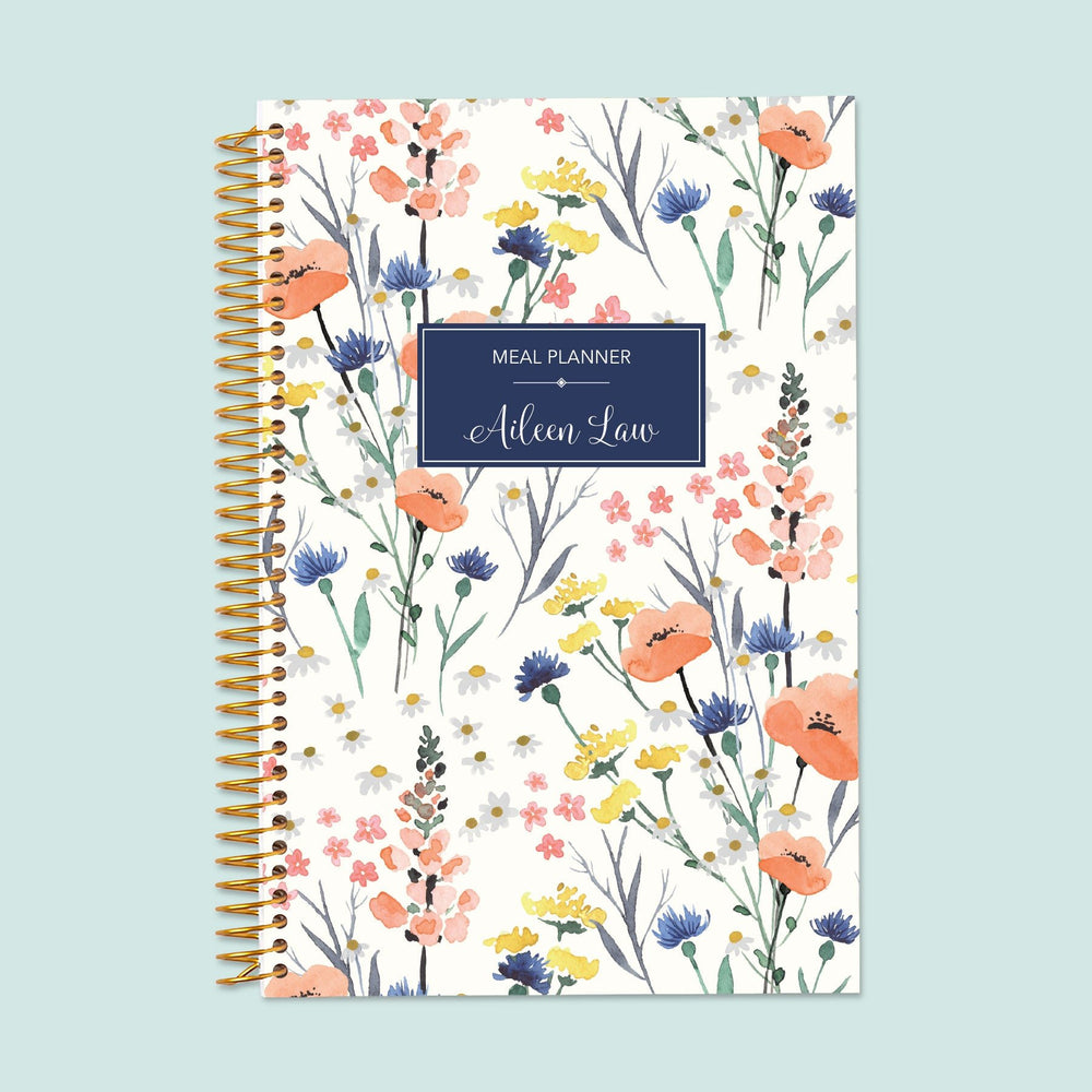 6x9 meal planner with a Field Flowers Blue cover, featuring premium pages for structured meal tracking, grocery budgeting, and healthy meal planning.