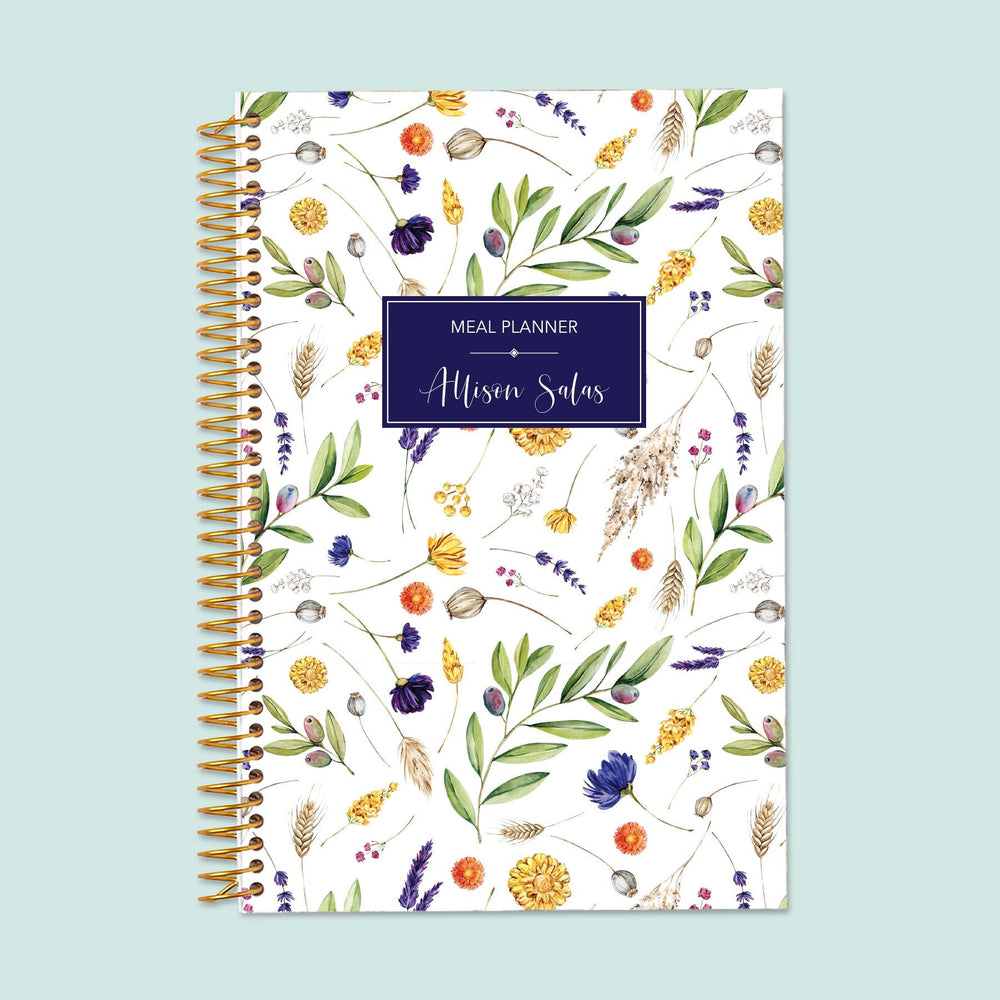 6x9 meal planner with a Summer Florals cover, keeping your meal plans fresh and organized with structured planning pages for balanced eating and grocery lists.