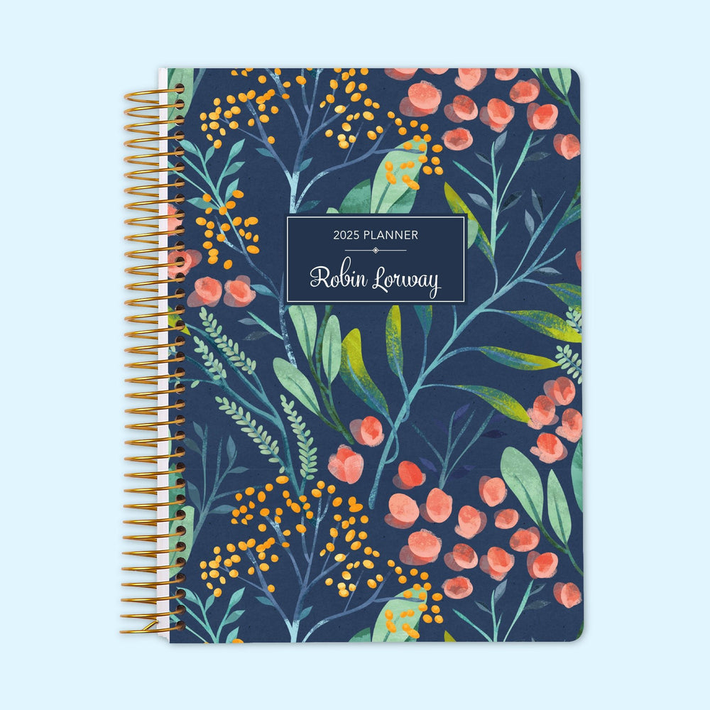 Monthly planner with a navy watercolor floral cover, featuring delicate painted blooms. Spiral bound for effortless organization.