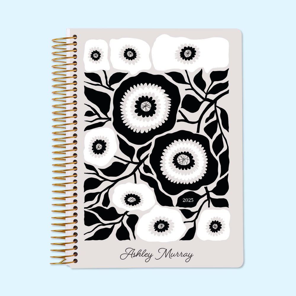 Monthly planner with a striking black and white artful floral cover. Classic monochrome meets productivity for effortless planning.