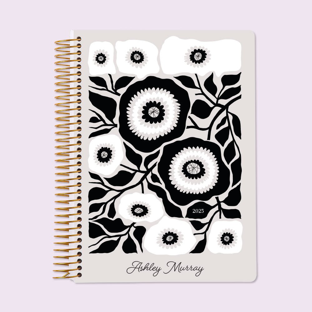 Self-care planner with a timeless Black & White floral cover, created for mindfulness, habit tracking, and personal well-being planning.