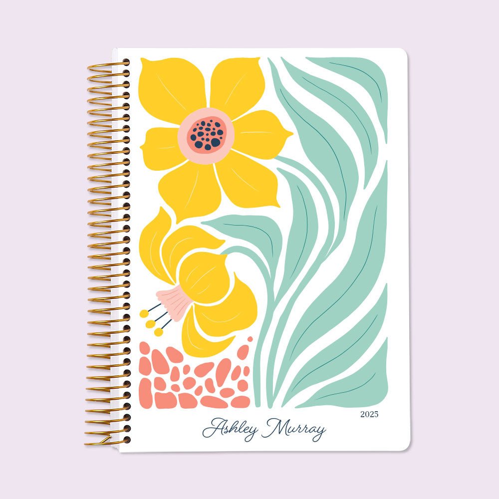 Self-care planner with a bright Artful Daffodil cover, perfect for tracking wellness goals, gratitude, and daily self-care practices.