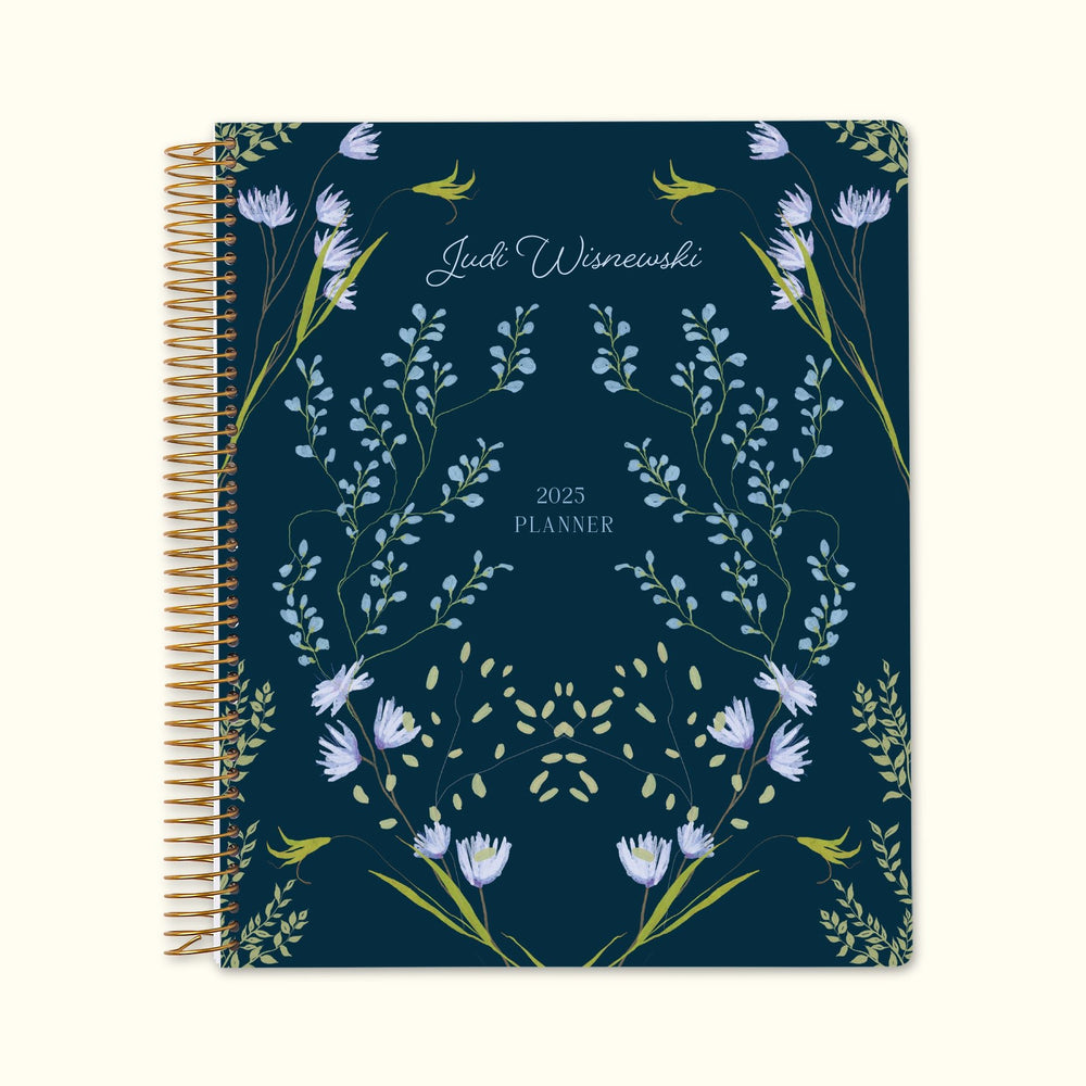 8.5x11 monthly planner with a charming blue flower frame cover, blending floral elegance with smooth paper and structured monthly planning pages for an organized year.