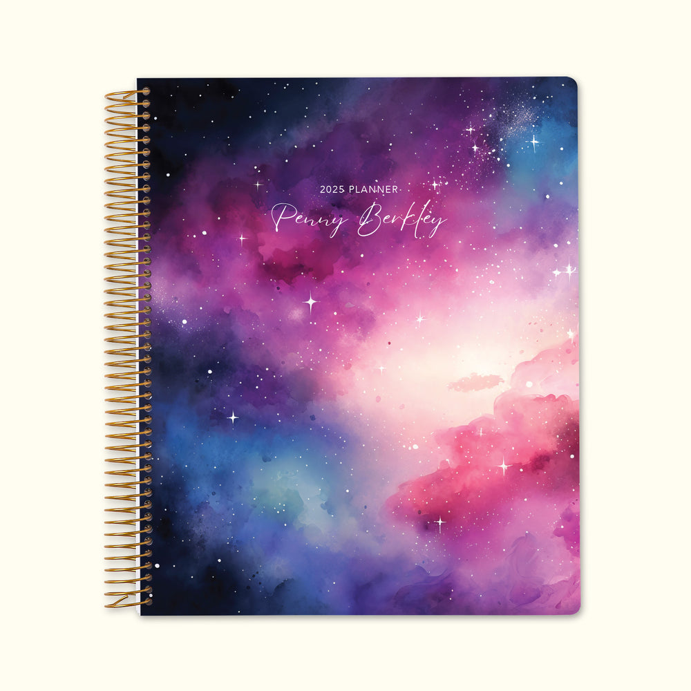 8.5x11 monthly planner with a dreamy space galaxy pink and blue cover, showcasing cosmic hues, durable paper, and spacious monthly layouts for effortless organization.