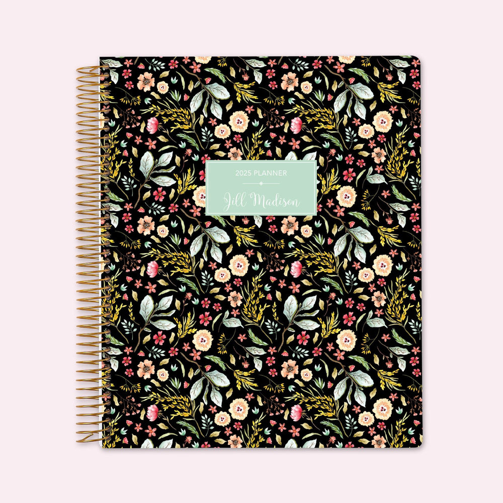 8.5x11 teacher planner with a black meadow floral cover, featuring soft wildflowers on a dark background, high-quality paper, and structured lesson planning pages.