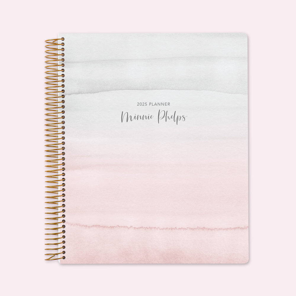 8.5x11 teacher planner with a vibrant pink watercolor gradient cover, showcasing soft transitions, premium paper, and spacious planning pages for lesson organization.