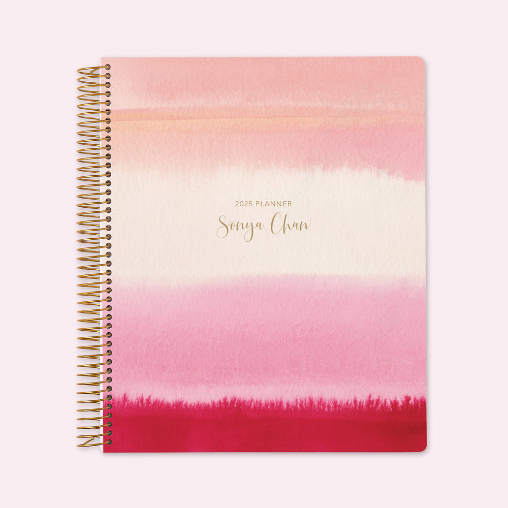 8.5x11 teacher planner with a subtle pink gray watercolor gradient cover, featuring soft brushstrokes, durable paper, and well-structured teacher planning layouts.
