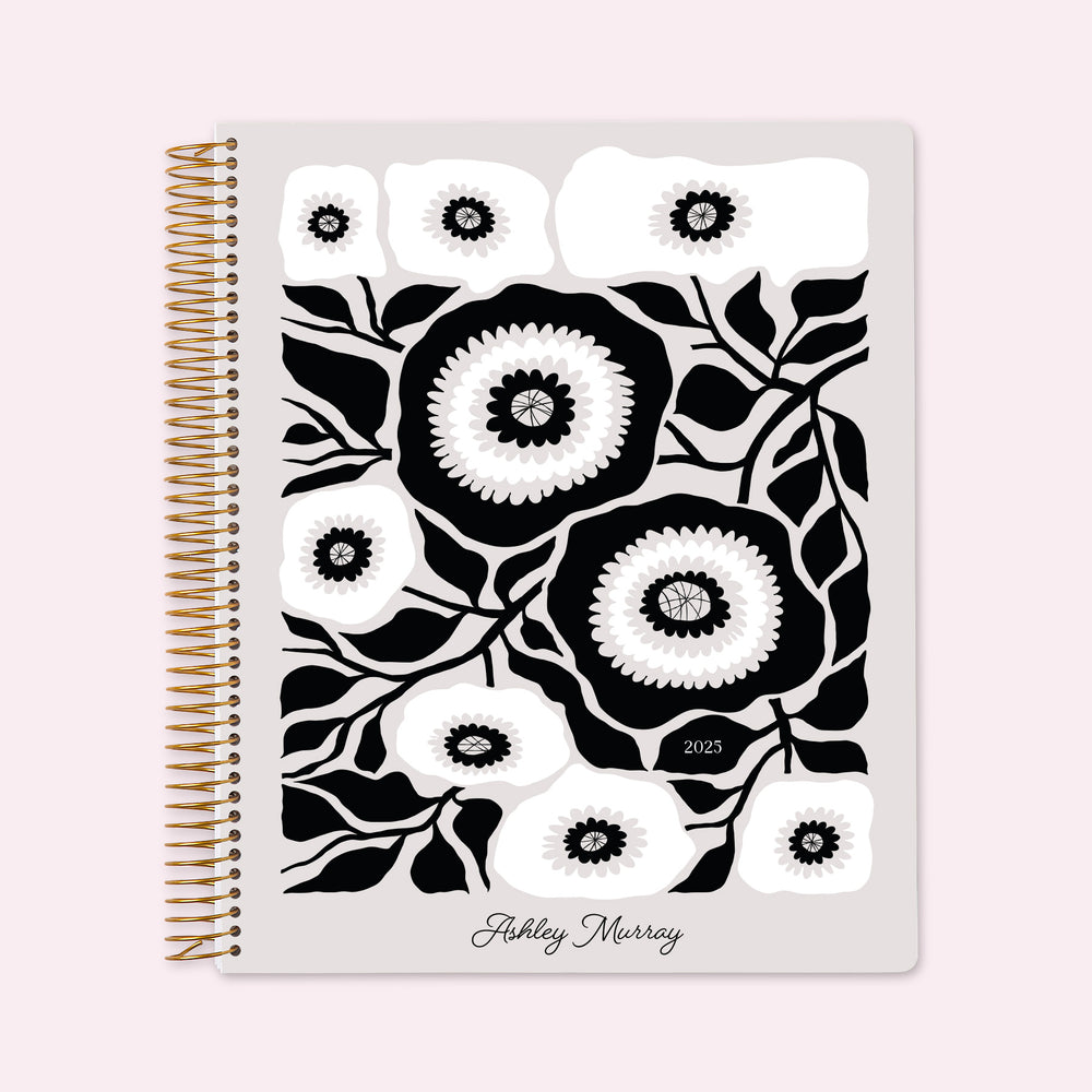8.5x11 teacher planner with a bold artful flowers black and white cover, showcasing elegant monochrome florals, high-quality paper, and functional teacher layouts.