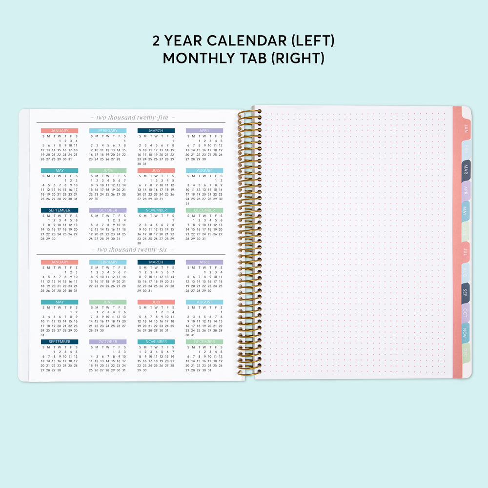 a planner with a calendar on top of it