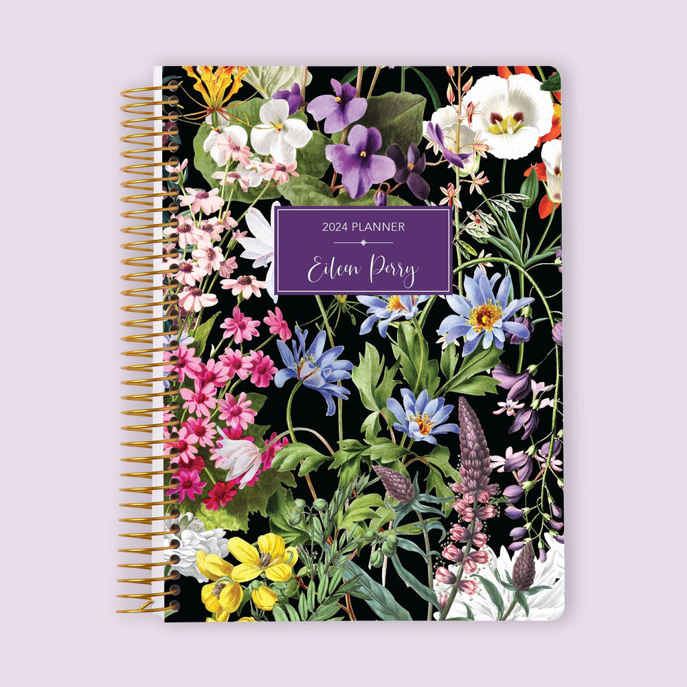 Self-care planner with a Colorful Florals Black cover, featuring a bold floral design with space for self-care routines and reflection.