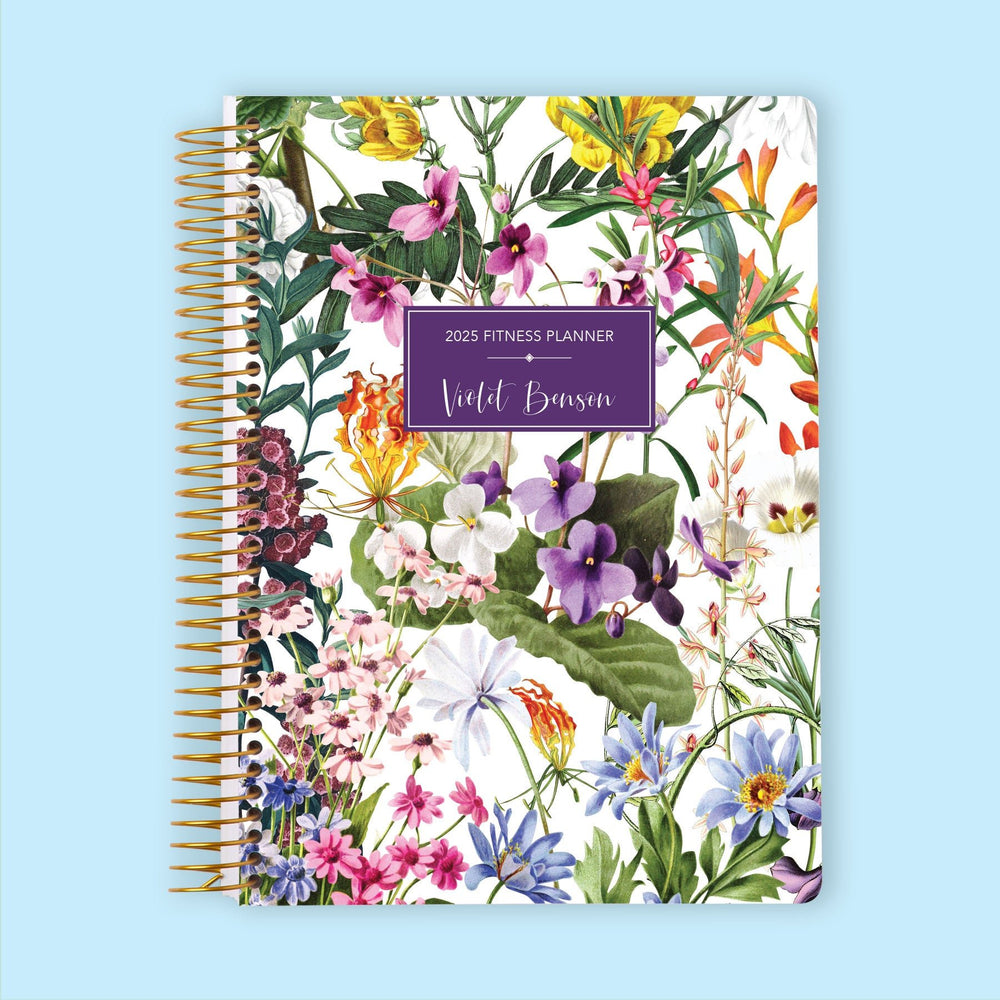 Fitness planner with a Colorful Florals White cover, featuring a delicate floral design for structured fitness planning.