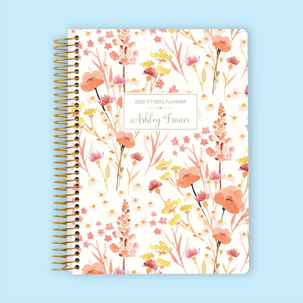 Fitness planner with a Field Flowers Pink cover, an elegant floral planner designed for tracking fitness and wellness progress.