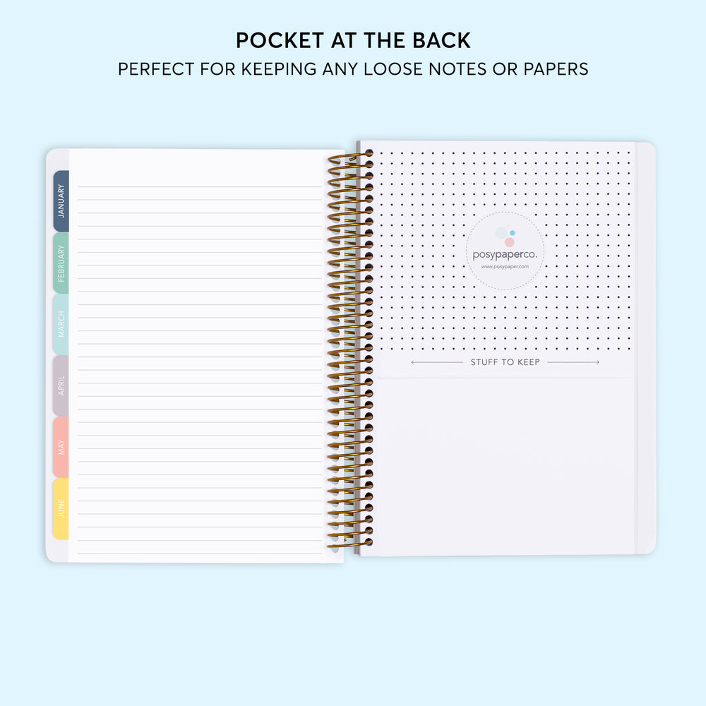 a spiral bound notebook with a dotted page at the back