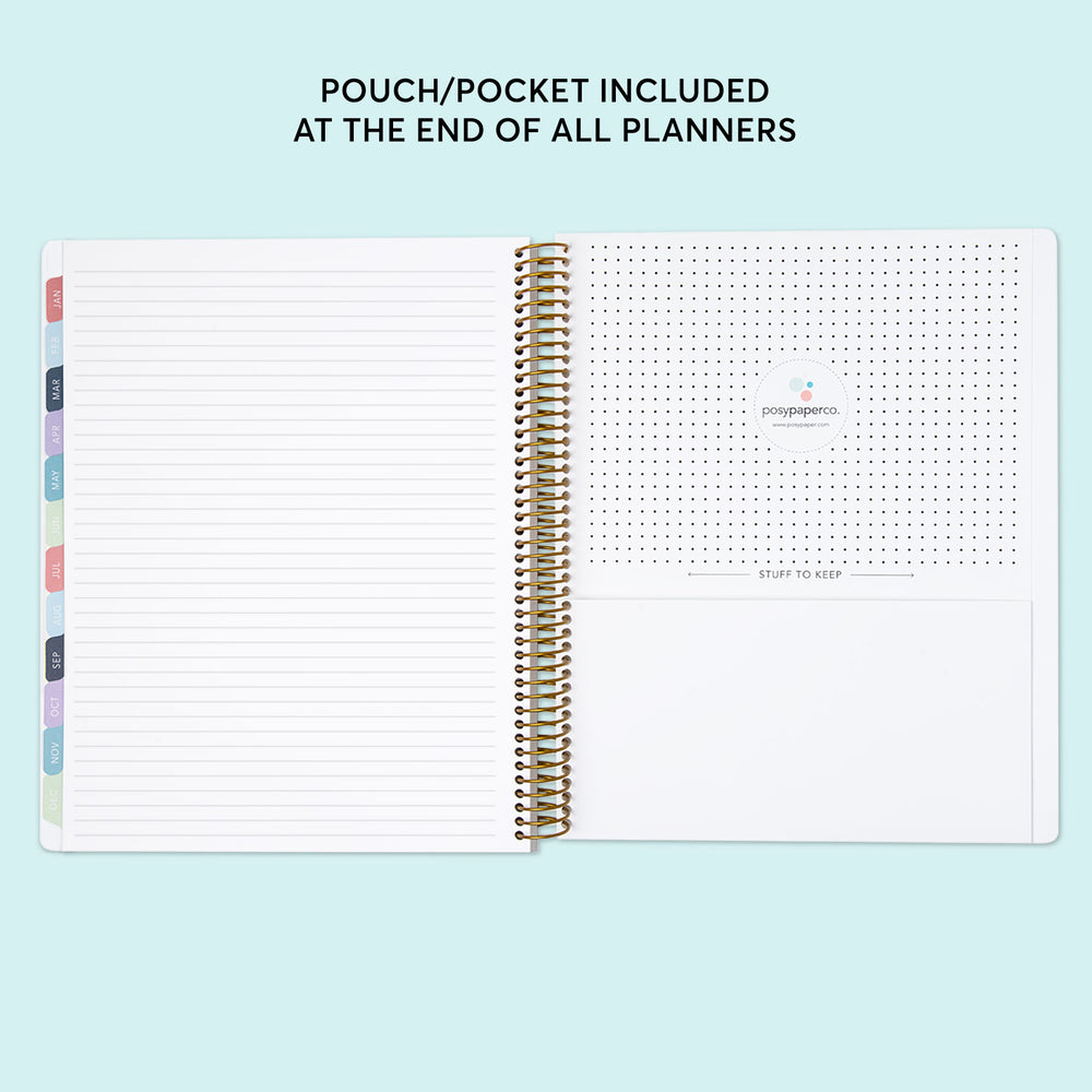 a notebook with a planner and pen on top of it