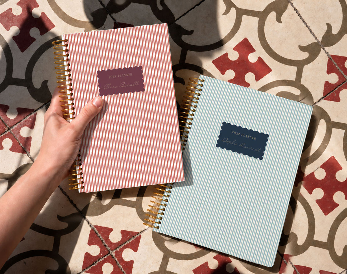 A personalized Harbor Linen planner held in a quiet moment at home
