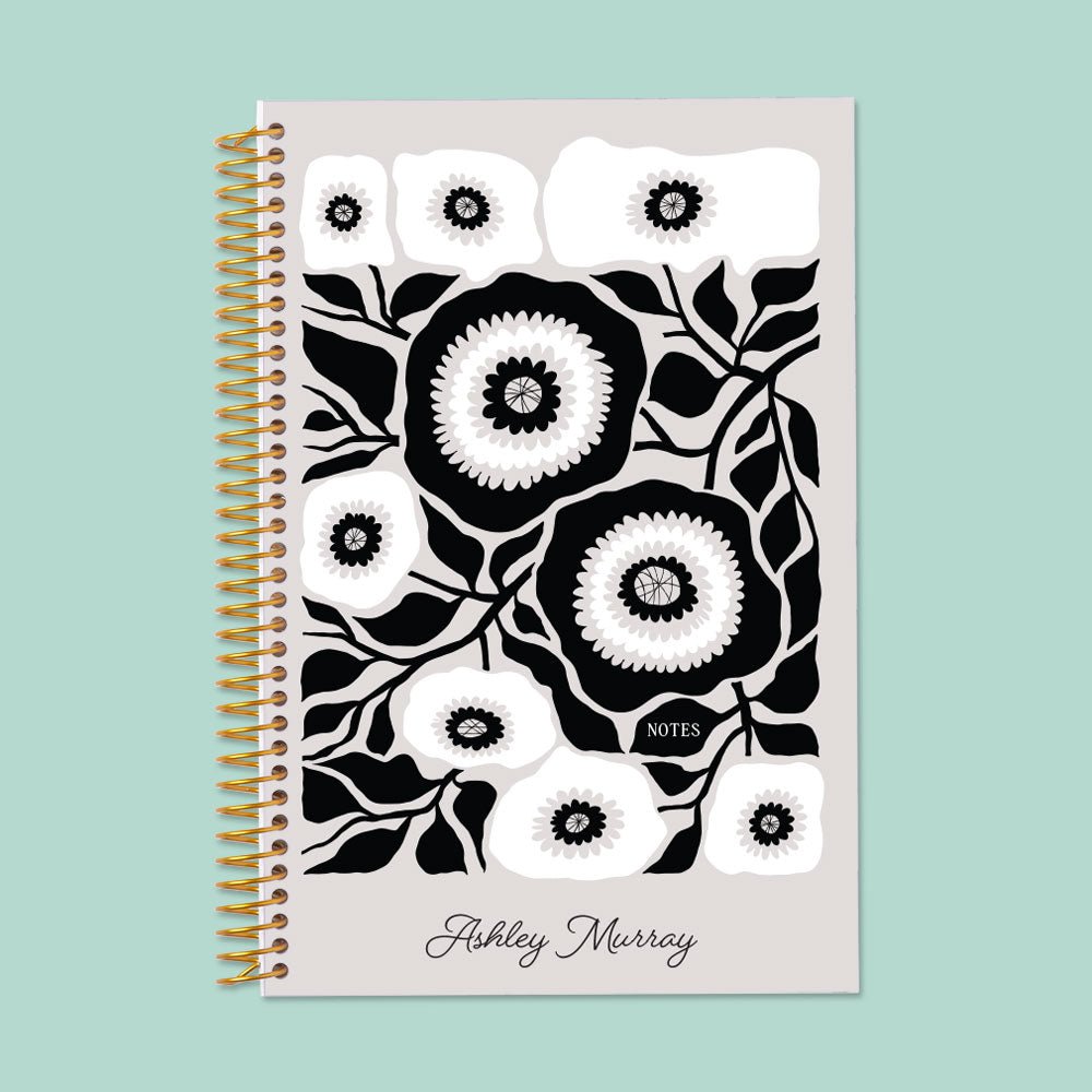 Minimalist black and white floral notebook, offering premium paper and a sturdy binding for elegant note-taking.