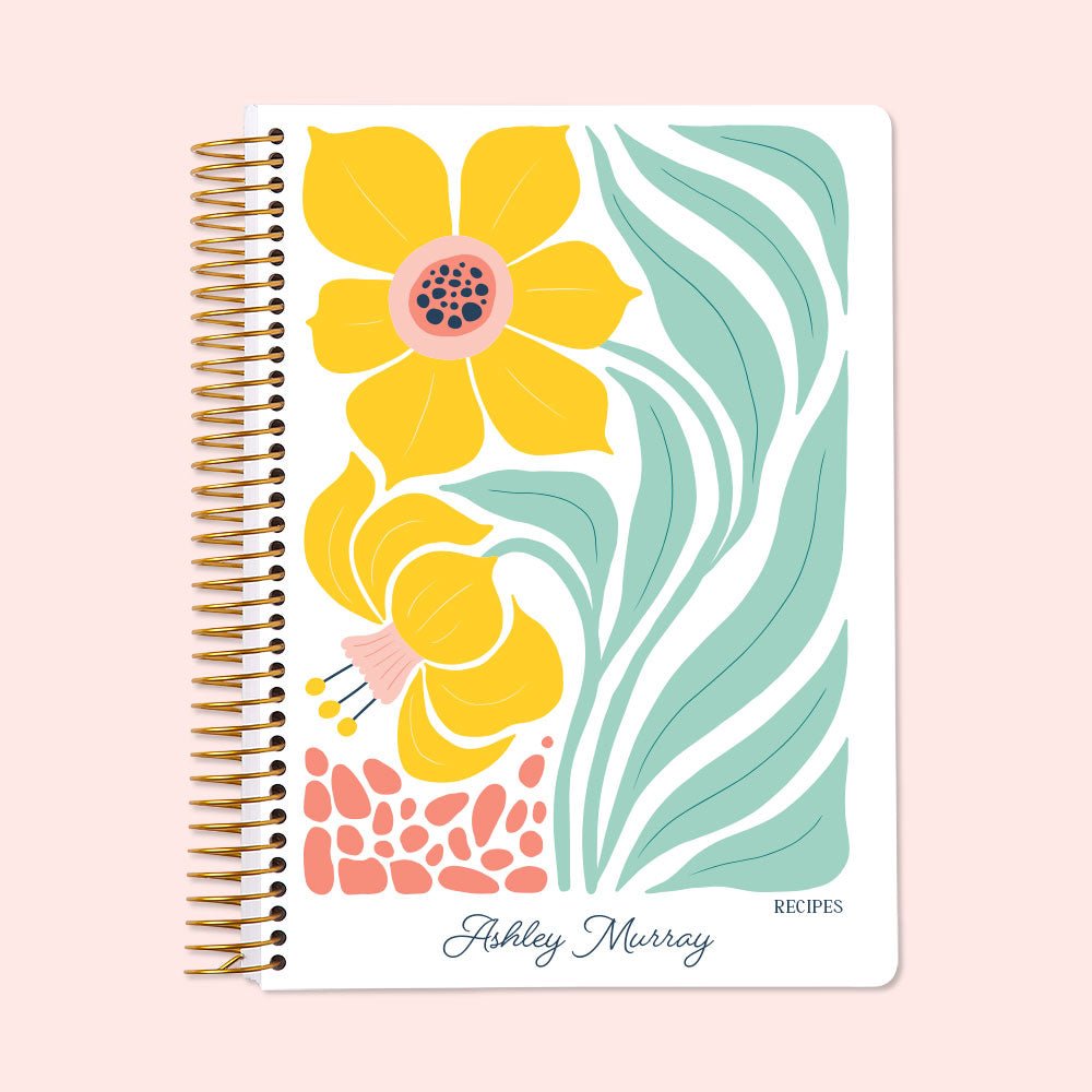 Personalized recipe book with an Artful Flowers Daffodil cover, featuring vibrant yellow floral illustrations for organizing recipes and cooking notes.