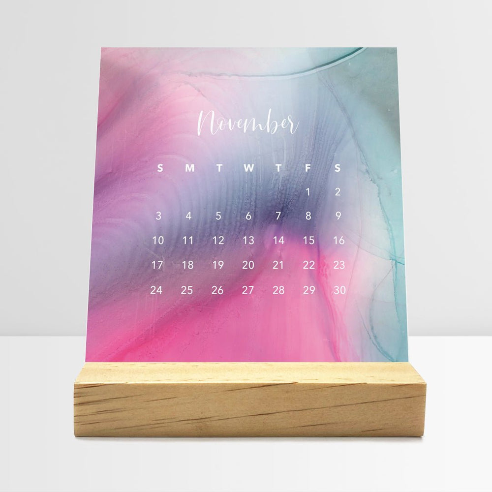Posy Paper Co. 2024 desk calendar with flowing ink design displaying November dates.