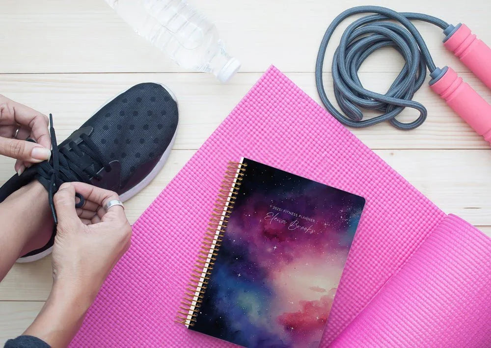 fitness planner layout showing weekly workouts, habit tracker and nutrition notes