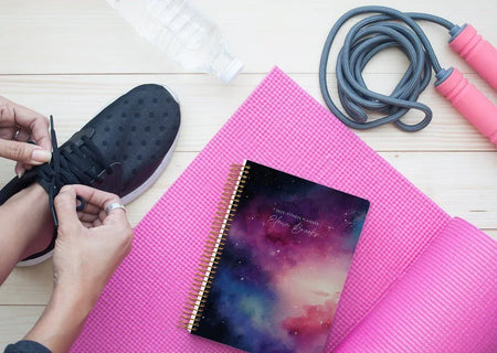 Posy Paper Co. fitness planner showing weekly exercise log and habit tracker, handcrafted in Vancouver Canada”
