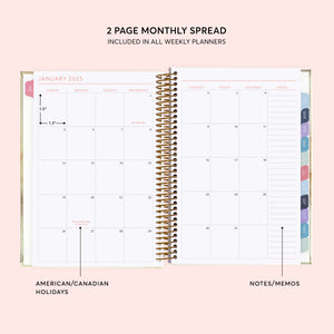 
                  
                    Two-page monthly calendar spread with a notes column and colored month tabs.
                  
                