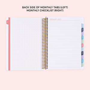
                  
                    a planner with a pink cover and a pink background
                  
                