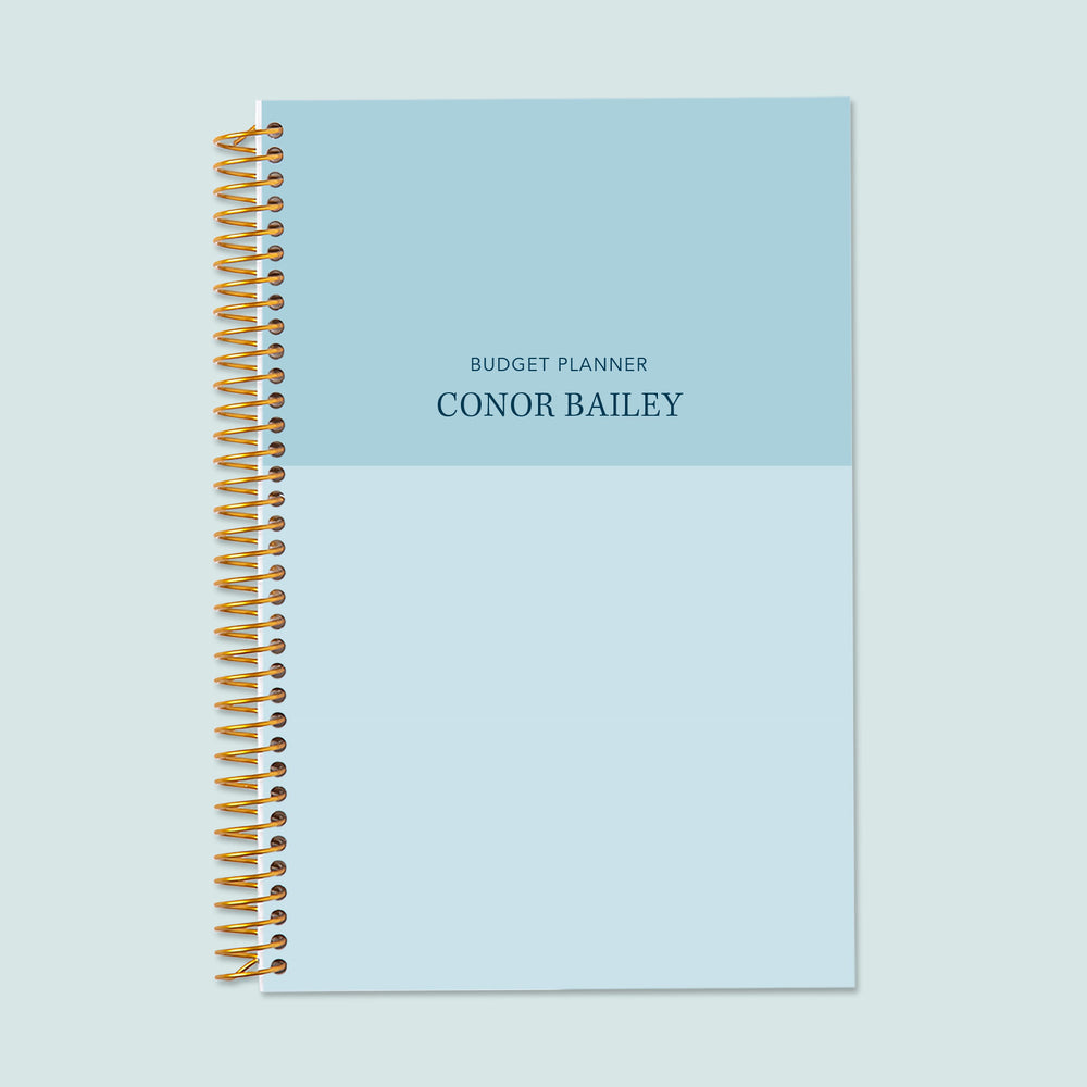 6x9 budget planner with a blue color block cover, featuring a contemporary dual-tone design, structured financial logs, and high-quality writing pages.
