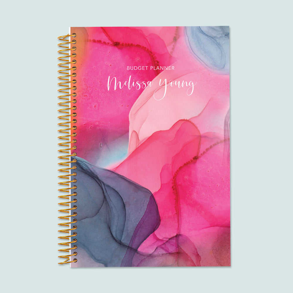 6x9 budget planner with a hot pink gray flowing ink cover, designed with bold swirling colors, organized budget layouts, and durable pages for financial success.
