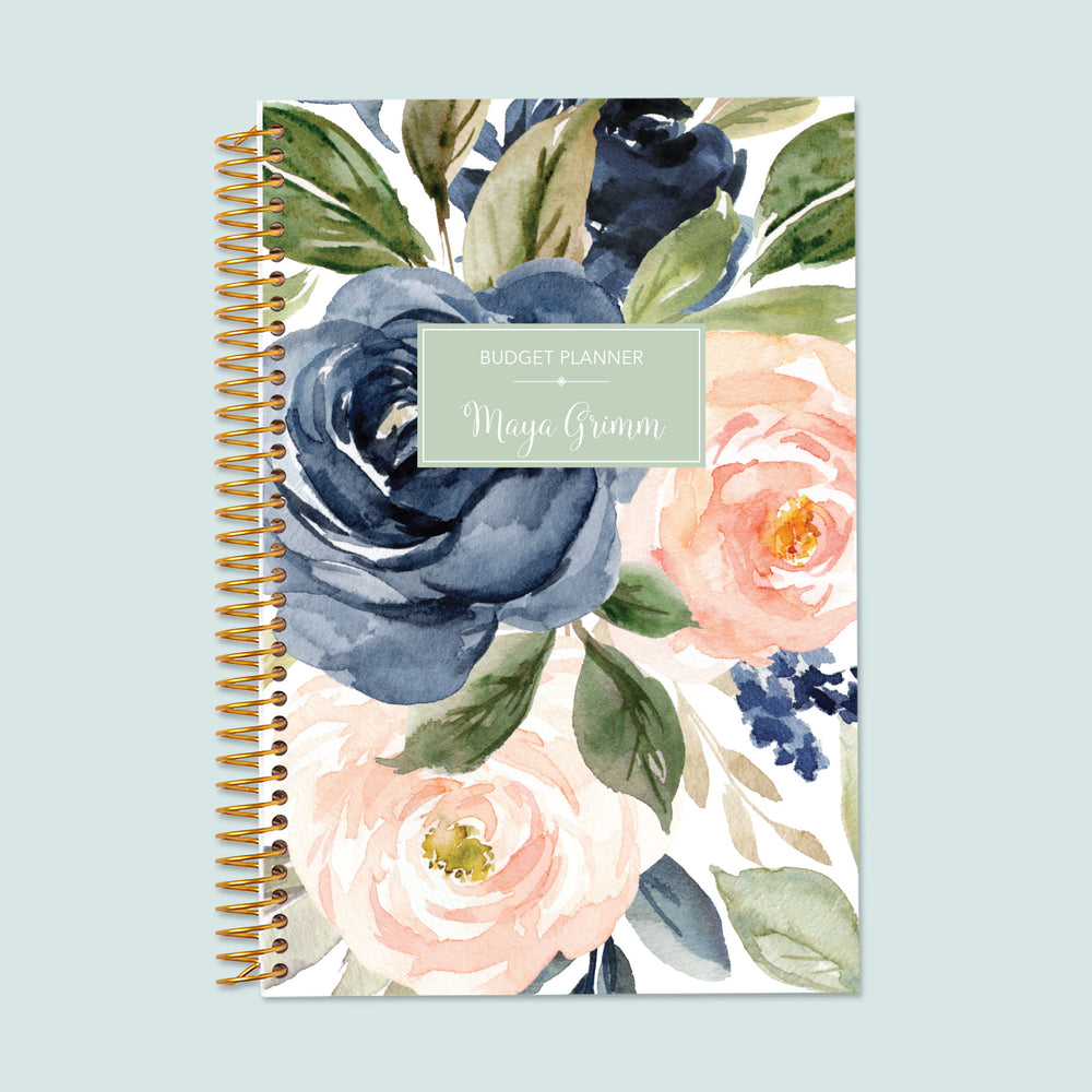 6x9 budget planner with a navy blush roses cover, a delicate floral aesthetic, goal-oriented financial trackers, and space for long-term money planning.
