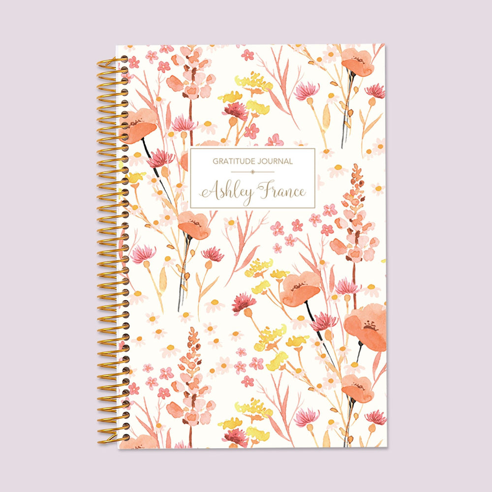 Gratitude journal with a Field Flowers Pink cover, inviting mindfulness and appreciation with a nature-inspired floral design.