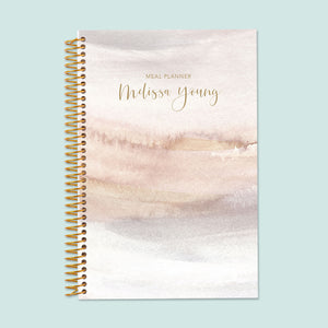 
                  
                    6x9 meal planner with a Neutral Watercolor Gradient cover, offering structured meal logs, grocery list planning, and healthy habit tracking.
                  
                