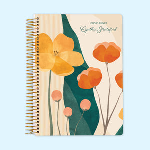 
                  
                    Monthly planner with a striking abstract floral cover, blending bold pink, orange, and blue brushstrokes for a contemporary artistic look, finished with a sturdy coil binding.
                  
                