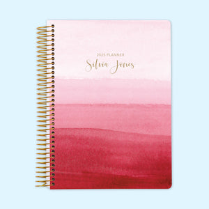 
                  
                    Monthly planner featuring a soft pink ombre watercolor cover, designed for stylish and organized planning. Coil bound for ease of use.
                  
                