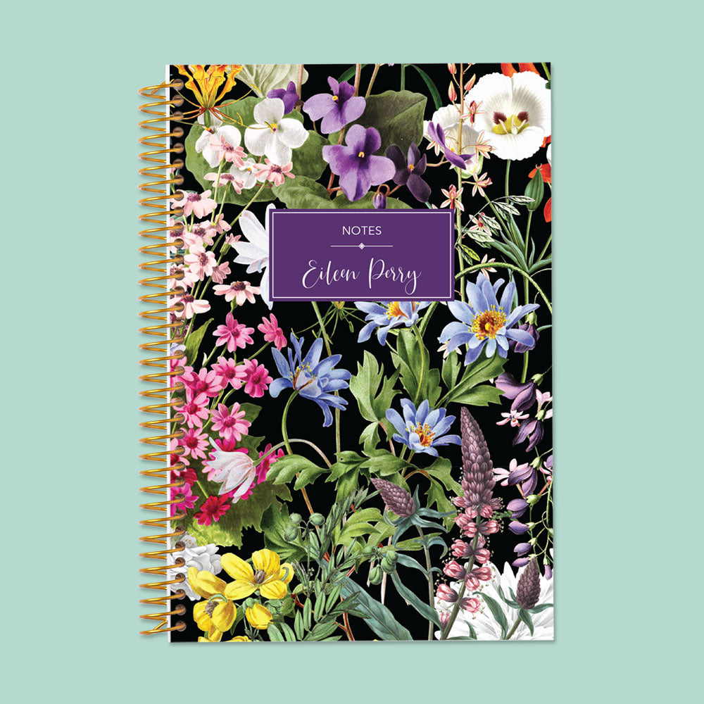 Dark floral notebook with a dramatic black background and bold flowers, offering smooth writing pages and a stylish spiral-bound design.