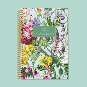 
                  
                    6×9 notebook with a Colorful Florals Green cover and gold coil binding.
                  
                