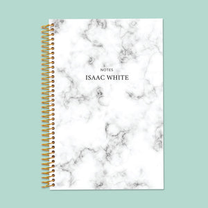 
                  
                    6×9 notebook with a Gray Marble cover and gold coil binding.
                  
                