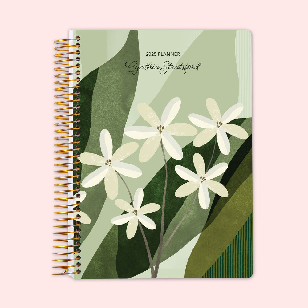 Weekly planner with a creative green abstract floral cover, featuring artistic leaf patterns, complemented by strong spiral binding and a personalizable cover to organize your plans with creative flair.