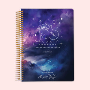 
                  
                    Weekly planner featuring an Aquarius zodiac cover, with the water-bearer constellation shining on a cool cosmic backdrop, finished with a durable coil binding and personalized name on the cover to keep you organized and inspired by the zodiac.
                  
                