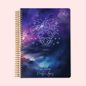 
                  
                    Weekly planner with a Cancer zodiac cover design, displaying the Cancer crab constellation on an enchanting night-sky background, secured by a sturdy spiral binding and personalized just for you to keep life organized and inspired.
                  
                