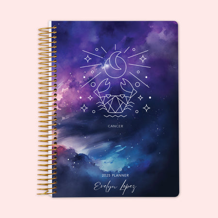 Weekly planner with a Cancer zodiac cover design, displaying the Cancer crab constellation on an enchanting night-sky background, secured by a sturdy spiral binding and personalized just for you to keep life organized and inspired.