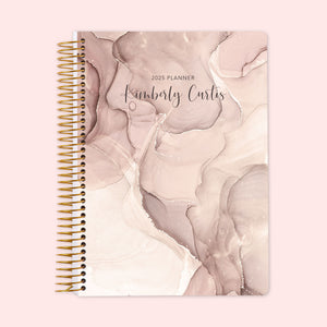 
                  
                    Weekly planner with a chic neutral abstract ink cover showcasing gentle beige-gray swirls, built with a strong spiral binding and personalized cover text to keep your schedule organized and sophisticated.
                  
                