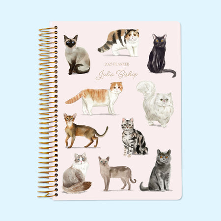 Personalized 6x9 daily planner with illustrated cat breeds on the cover – includes Ragdoll, Persian, Tabby, and more.