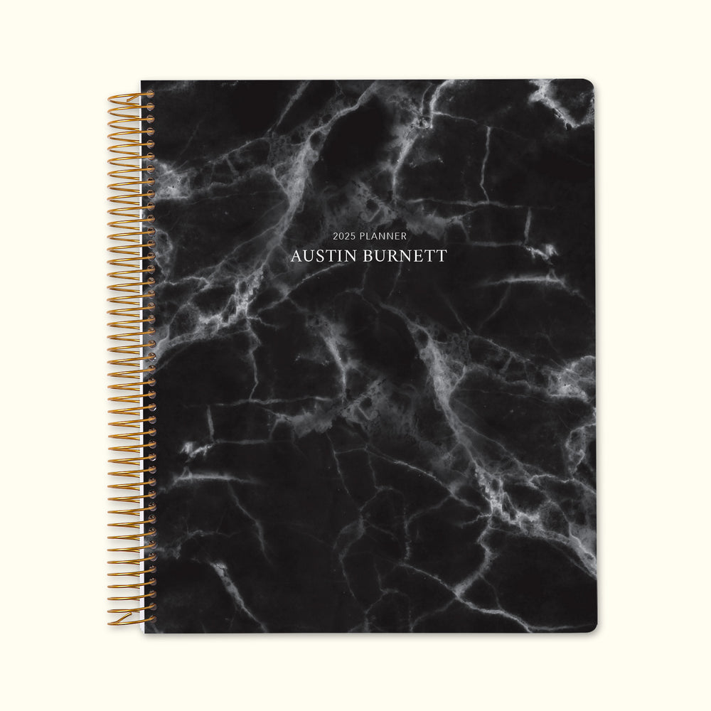 8.5x11 monthly planner with a sleek black marble cover, featuring a sophisticated aesthetic, durable paper, and spacious monthly layouts for effortless planning.