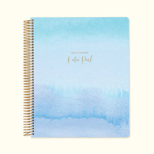 
                  
                    8.5x11 monthly planner with a tranquil blue lavender watercolor gradient cover, offering a serene aesthetic, high-quality paper, and structured monthly planning pages.
                  
                