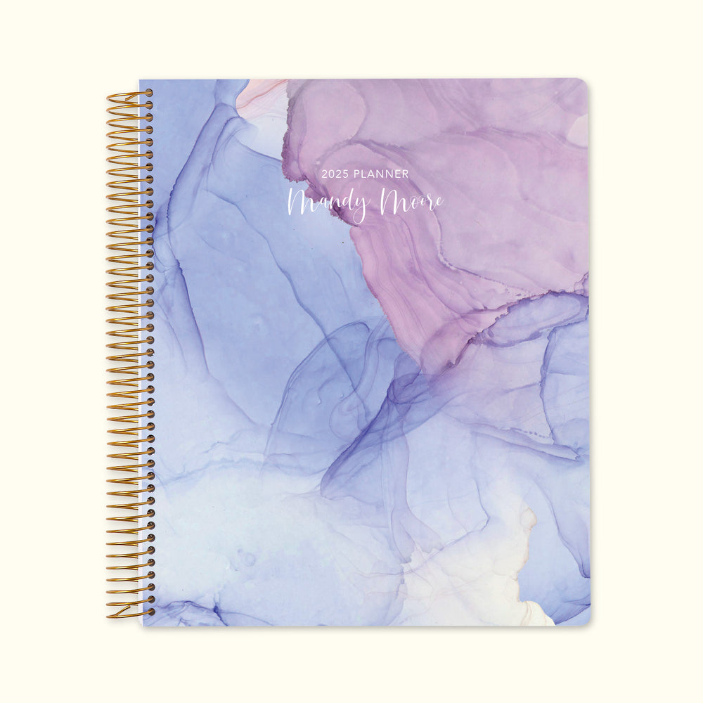 8.5x11 weekly planner with a serene blue and purple flowing ink cover, featuring fluid abstract swirls, premium paper, and spacious weekly layouts for effortless organization.