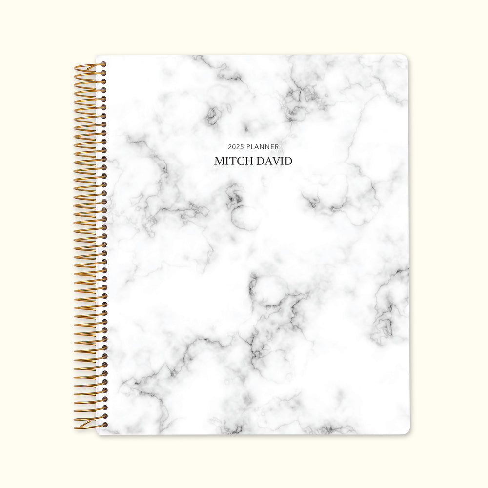 8.5x11 monthly planner with a classic gray marble cover, blending timeless design with high-quality paper and structured monthly pages for elegant organization.