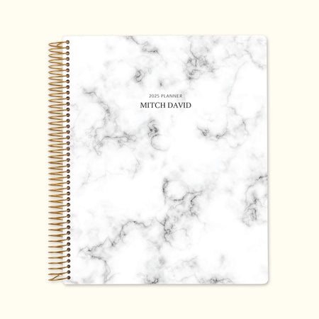 8.5x11 monthly planner with a classic gray marble cover, blending timeless design with high-quality paper and structured monthly pages for elegant organization.