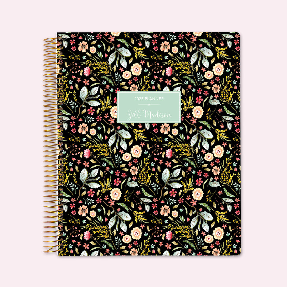 8.5x11 teacher planner with a black meadow floral cover, featuring soft wildflowers on a dark background, high-quality paper, and structured lesson planning pages.
